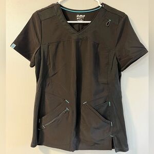 Black scrub top with blue accents